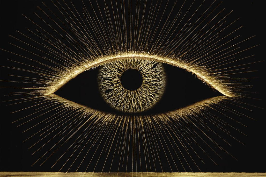 A radiant golden eye on black — reduce eye strain from screens