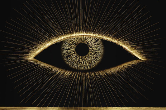 A radiant golden eye on black — reduce eye strain from screens