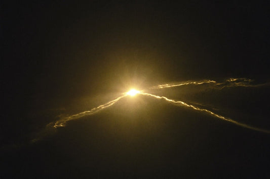 A soft golden light fading in the dark — why you feel tired all the time