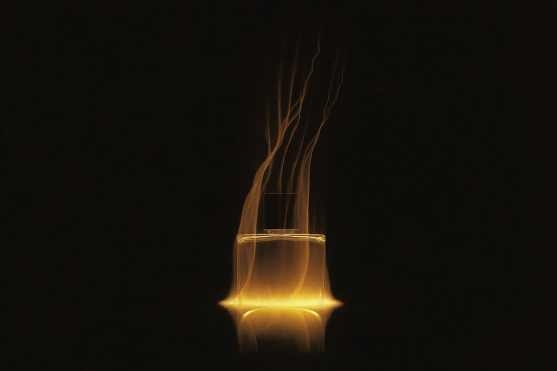 Glowing gold perfume bottle on black — long-lasting fragrance guide