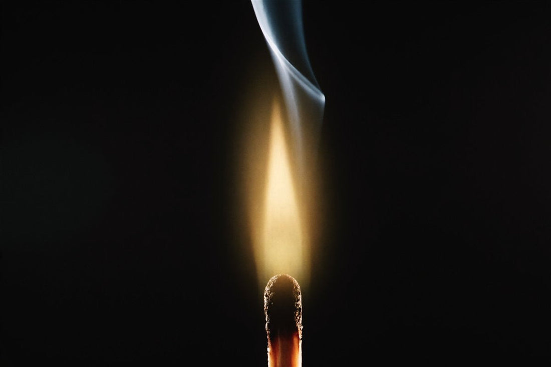 A single match igniting in darkness — how to stop procrastinating