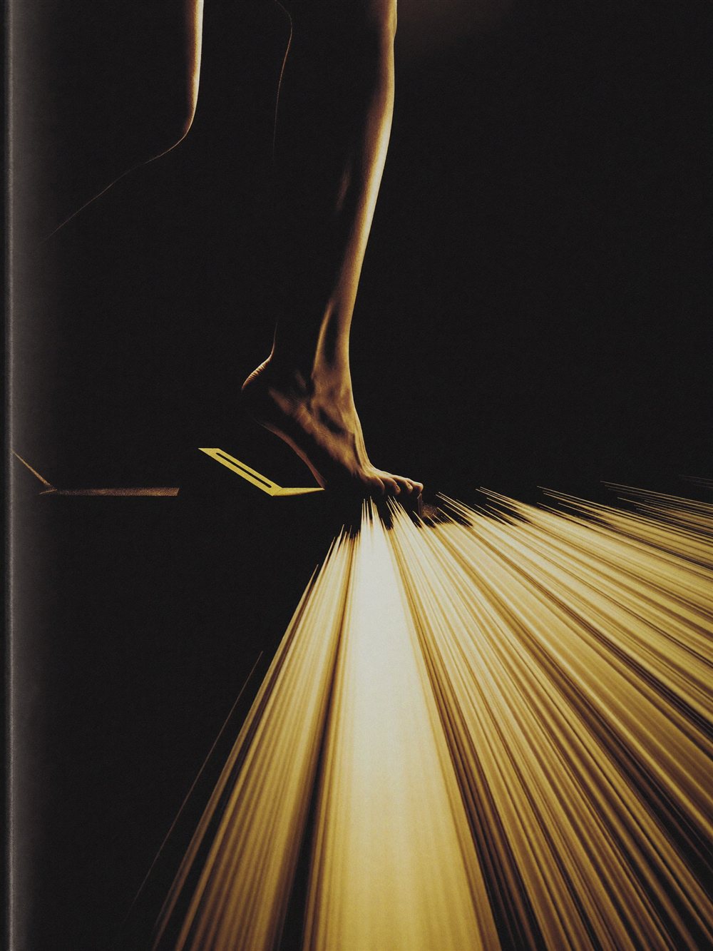 A runner's foot on a starting block exploding into momentum - flow and deep work