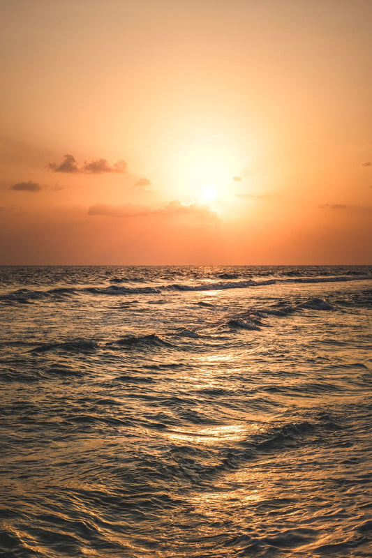 Golden sunrise over ocean waves — a new day breaking over the horizon