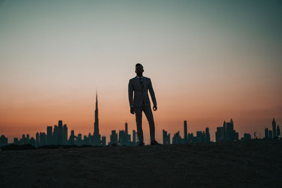 Entrepreneur silhouetted against a city skyline at twilight — facing the next decade of business
