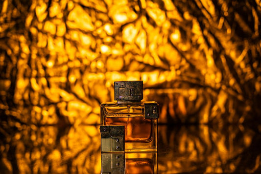 Luxurious perfume bottle against a golden bokeh background