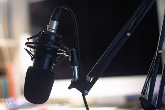 Condenser microphone in a studio setting for audio recording